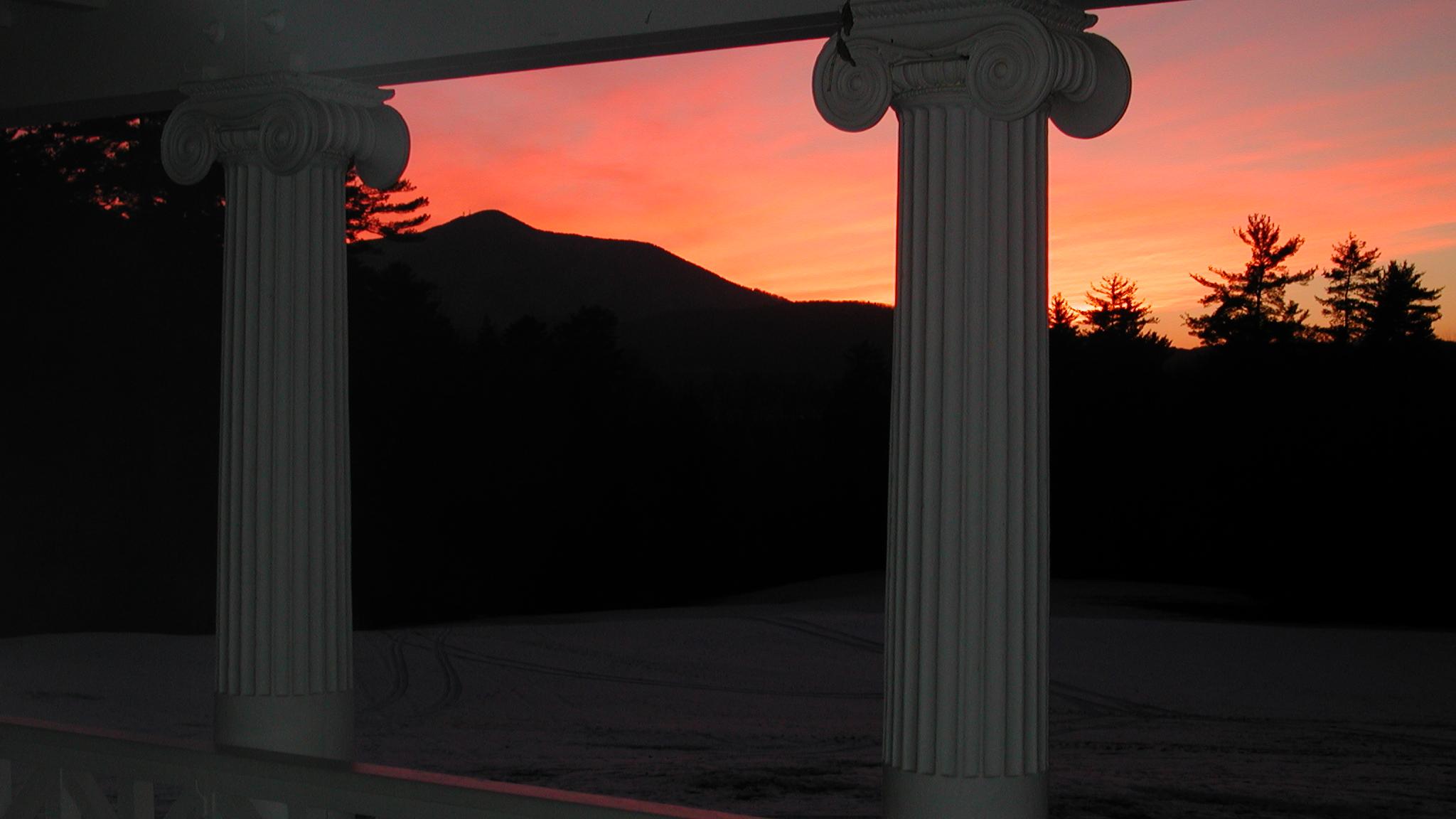 sunset behind mountain