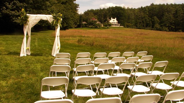 chairs and alter set up in field for a wedding ceremony