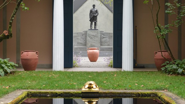 view of reflecting pool with monument in background