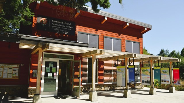 American Camp visitor center with display boards outside.