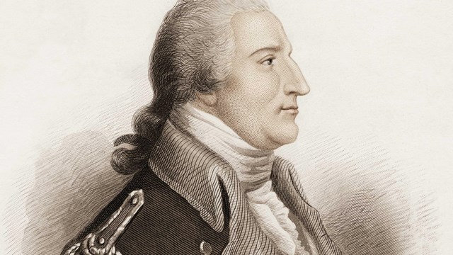 An older man in an 18th century uniform.
