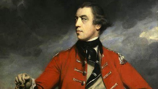 A man holding a sword in an 18th century British military uniform with a red coat and tan vest.