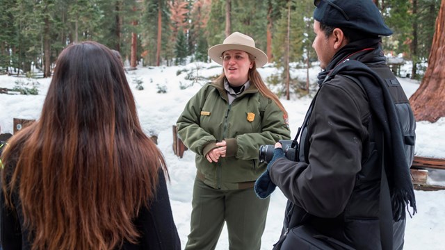 A ranger speaks with two visitors. Photo by Alison Taggart Barone