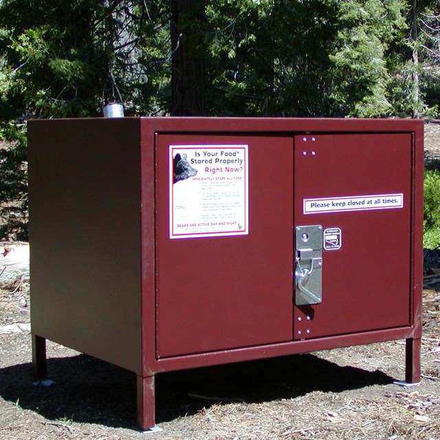 A metal food storage box is provided at each campsite.