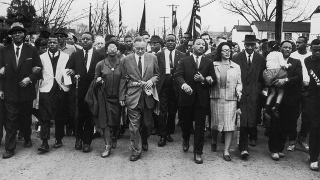 Martin Luther King Jr. and a large group of others march during the Selma to Montgomery marches