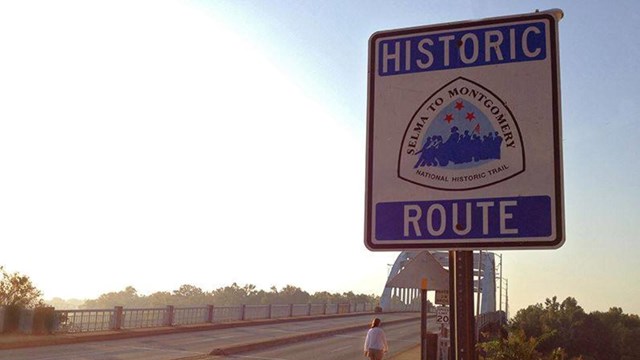 The Selma to Montgomery Historic Route sign at the foot of the Edmund Pettus Bridge