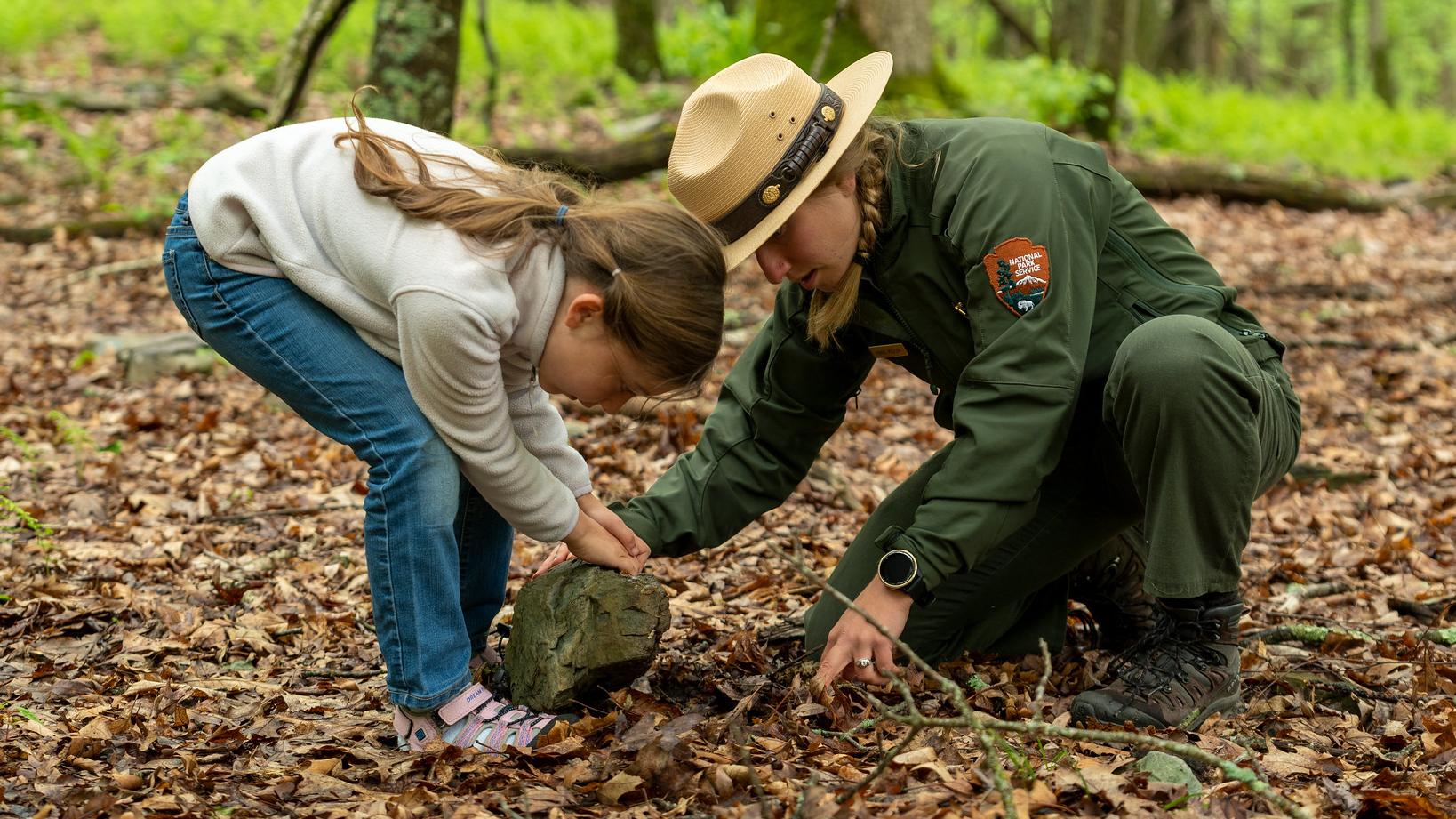 Child interacting with a Ranger during a program.