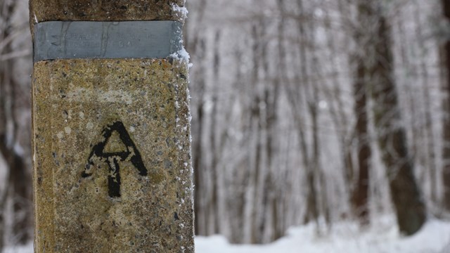 An arrow on a post indicating the Appalachian Trail
