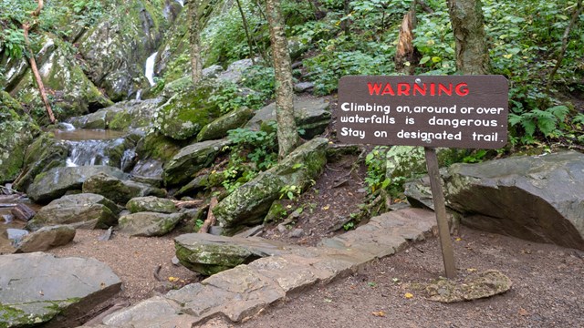 Warning sign at base of Dark Hollow Falls