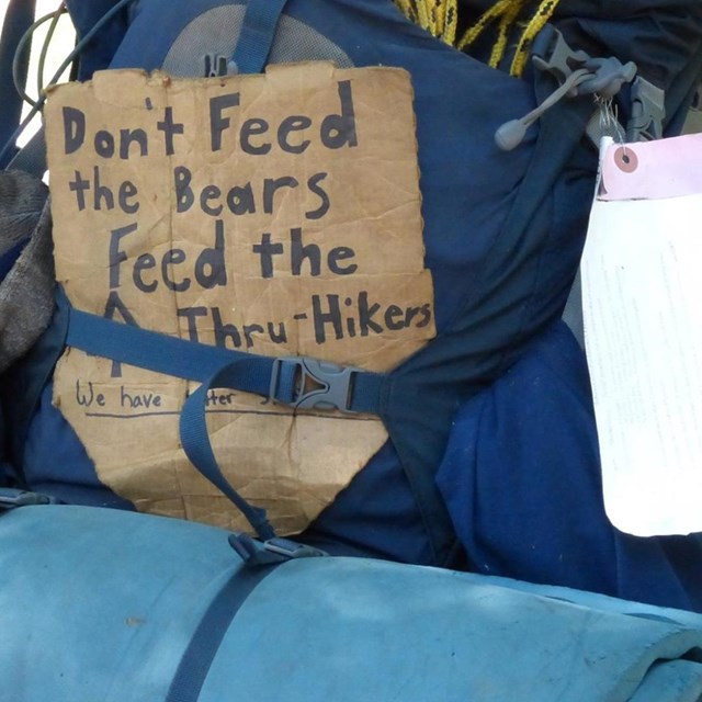 A large backpacking pack with the a sign reading 