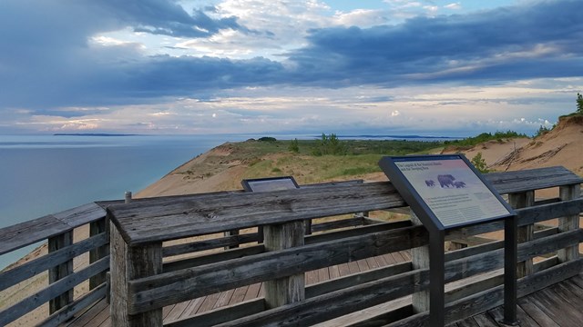 An overlook of Lake Michigan and the Dunes from a boardwalk.
