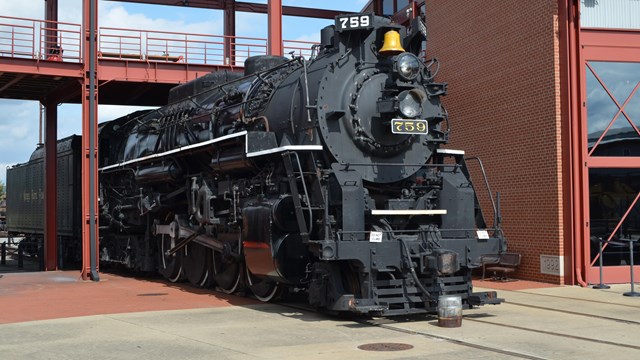 A historic steam locomotive on display in Steamtown's core complex. 