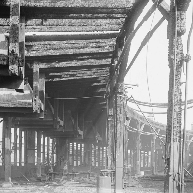 (Charred D.L. & W. roundhouse interior after fire)