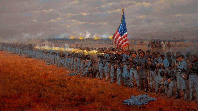 Union soldiers stand and fire next to an American flag. Moving troops and firing cannons behind.