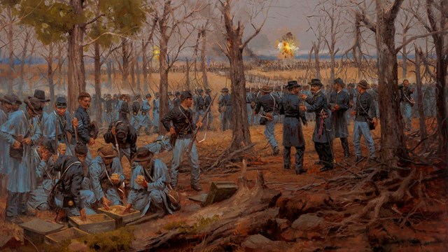 View of a Confederate attack from behind a line of Union soldiers.