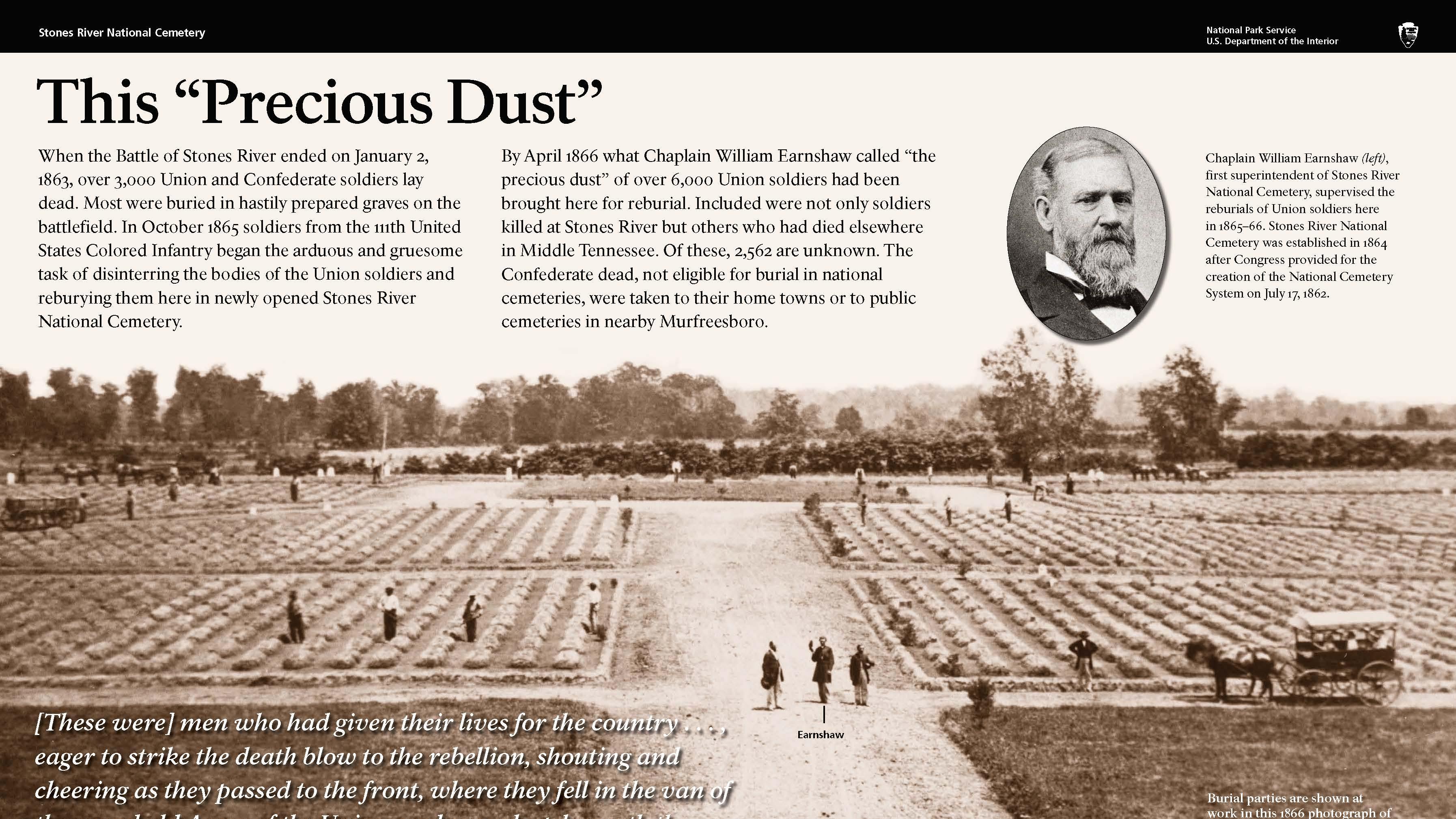 An exhibit showing a black and white photo of a cemetery with rows of earthen mounds.