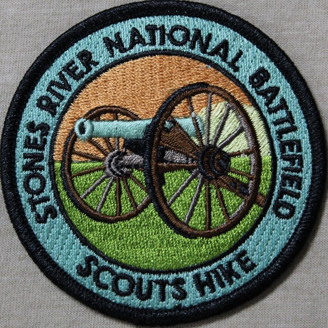 A patch with a cannon on it reading 