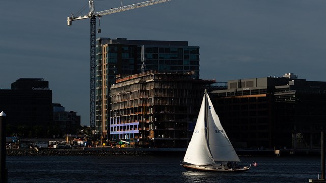 A sailboat in front of the Baltimore skyline