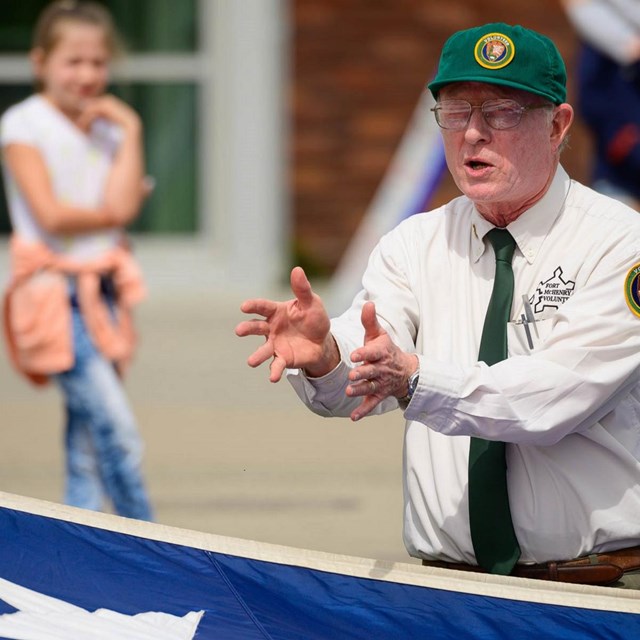 A person talking and gesturing with their hands. 