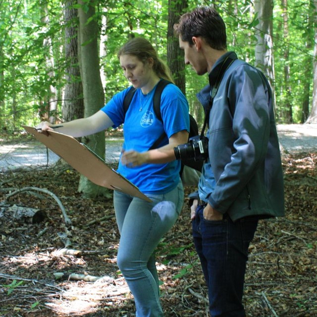 Boys helping repair a fence. NPS photo. 