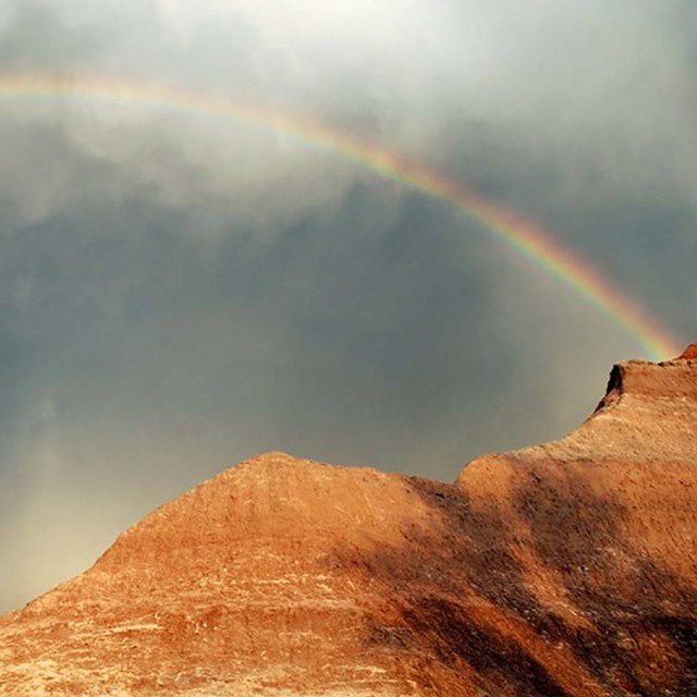 Photo of a rainbow over Badlands National Park by Shaina Niehans, NPS