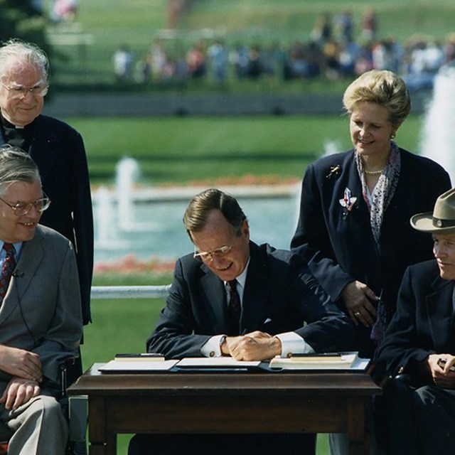 President GHW Bush signs the ADA. NMAH image