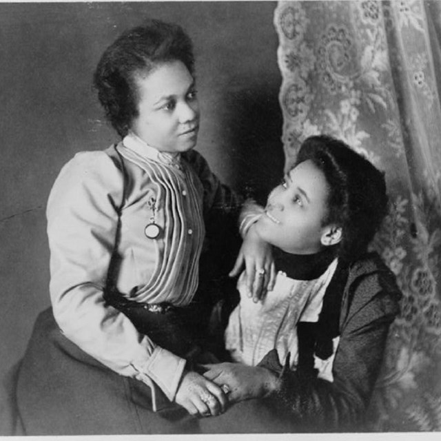 Two African American women sitting together
