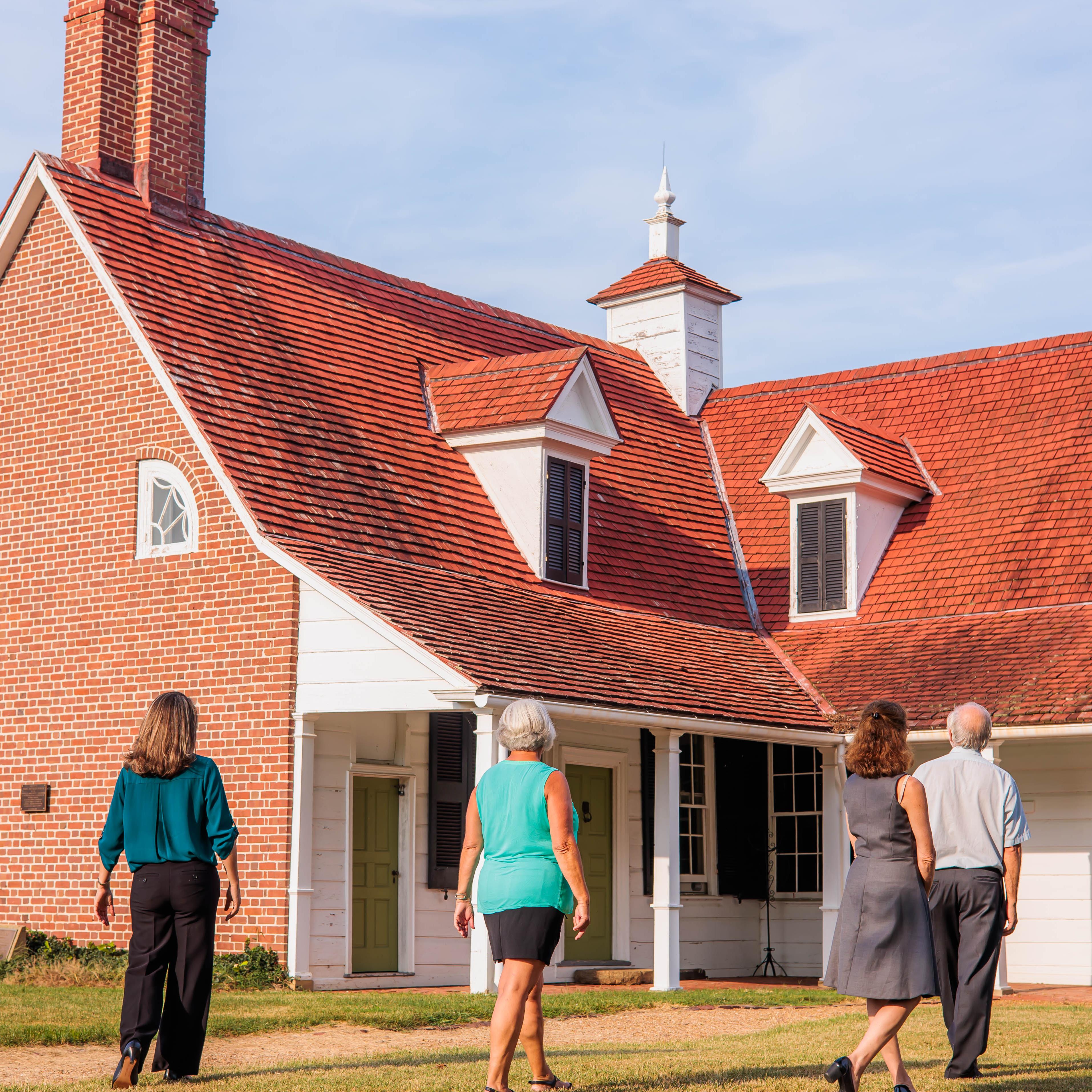 Picture of the Sotterley house with visitors walking up to it. Photo credit to Historic Sotterley.