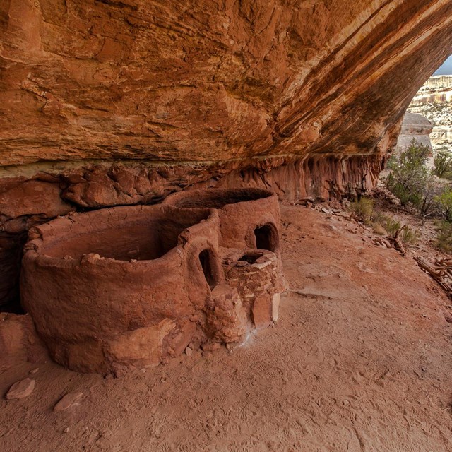 two circular stone structures tucked into an alcove