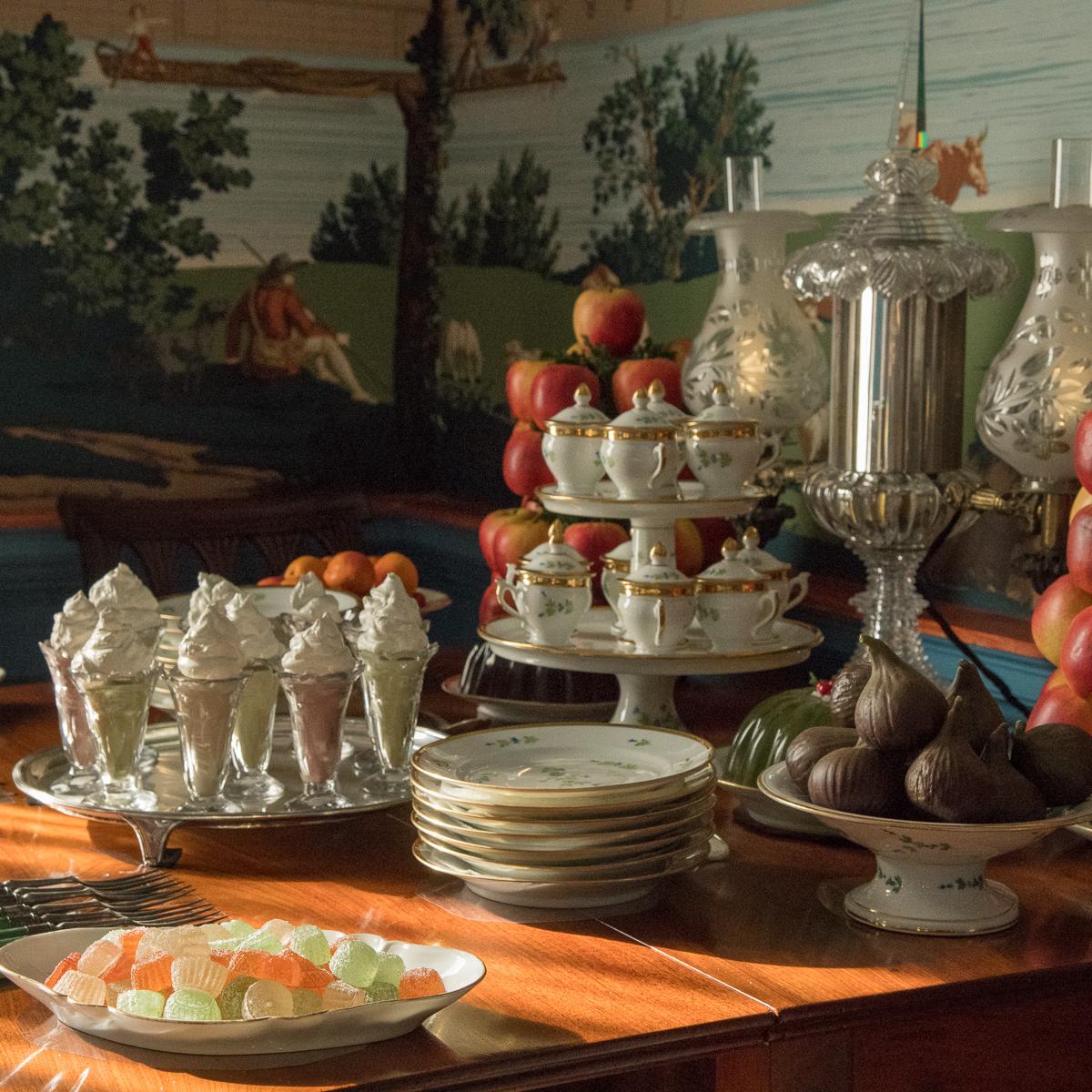 a table with fruits and ice cream on it from the Hampton Dining room.