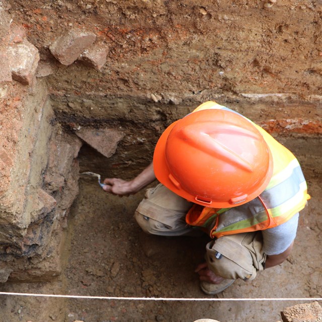 An archeologist digging