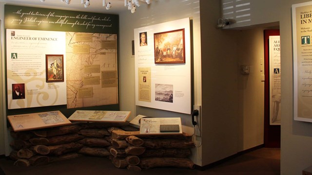 View of exhibit area with text and photos.