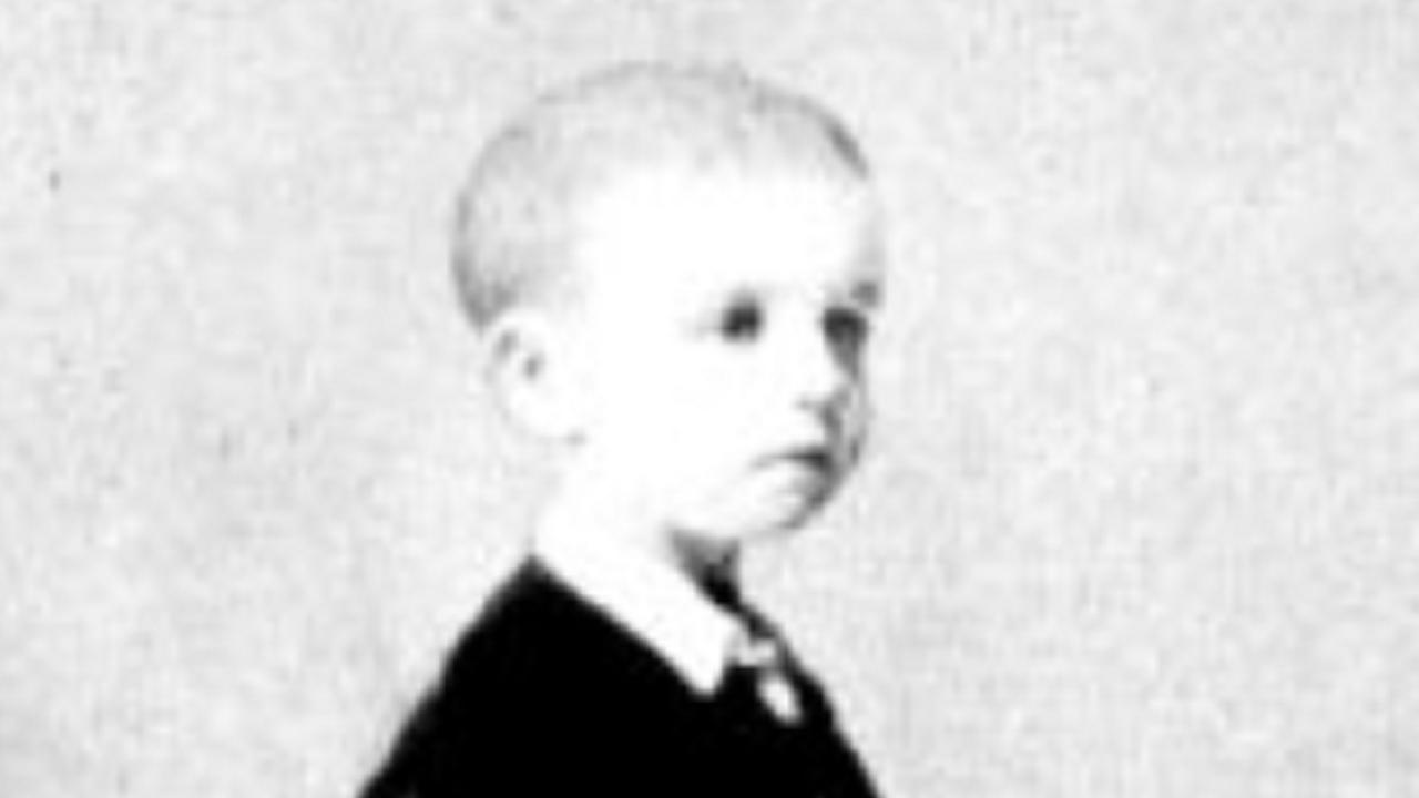 Black and white standing portrait of Elliot at age 5. 