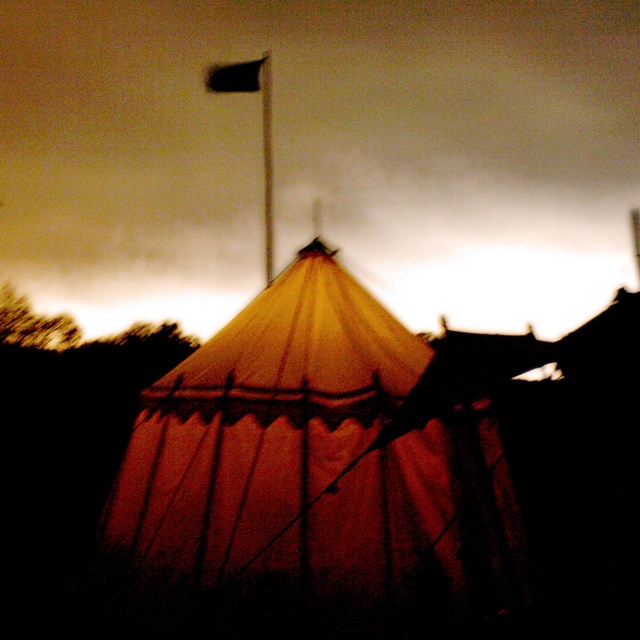 a tent light up at night