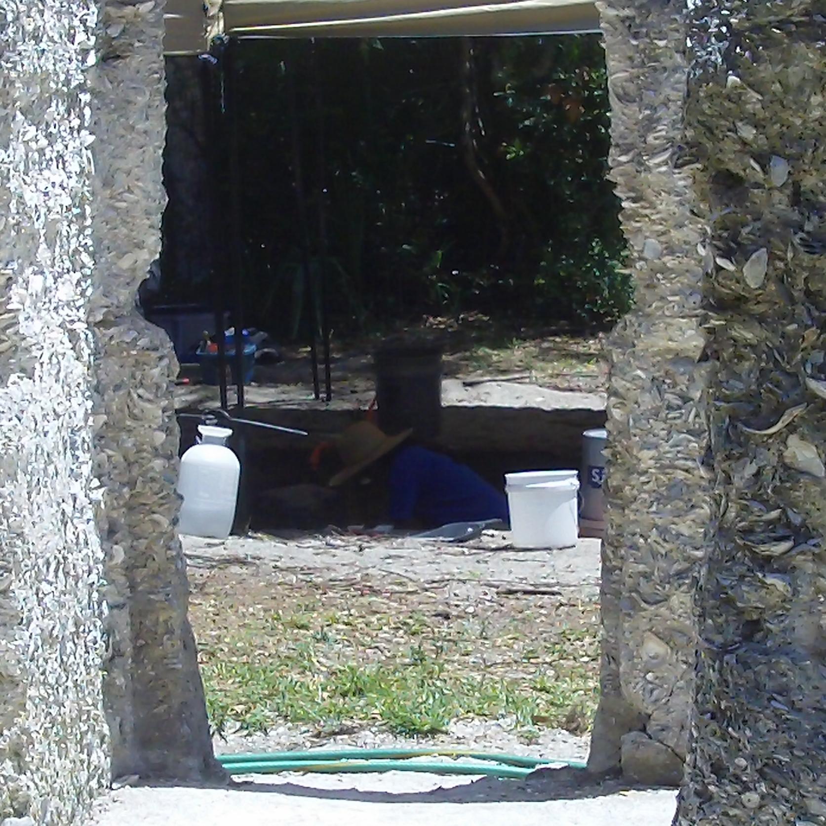 dig site seen from inside tabby slave cabin