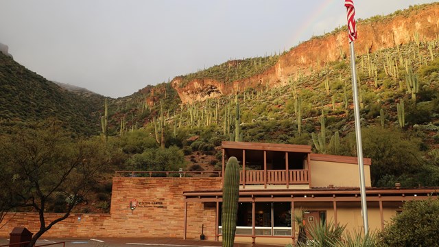 Photo of a building with the words "Visitor Center Tonto National Monument" on the side.