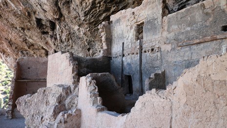 Image of the Lower Cliff Dwelling. Partial wall stands in front of a two story wall.