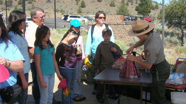 Ranger speaking with a group of people. NPS Photo