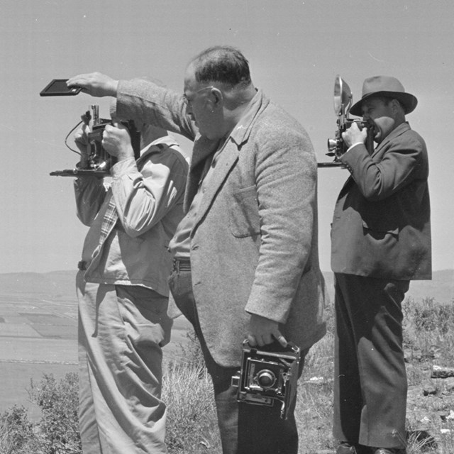 Newspaper cameramen from the San Francisco newspaper photograph a general view