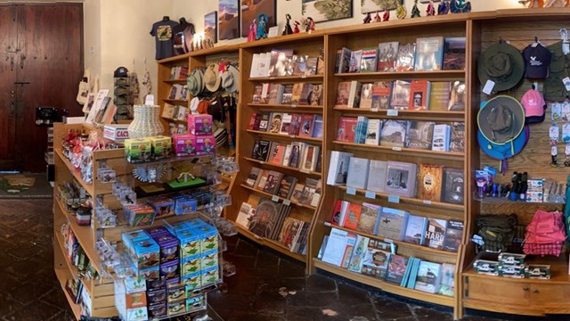 shelves full of books and other colorful sales items