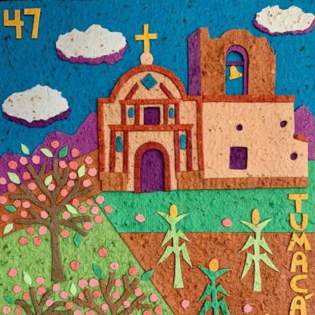 paper collage of church, trees, corn