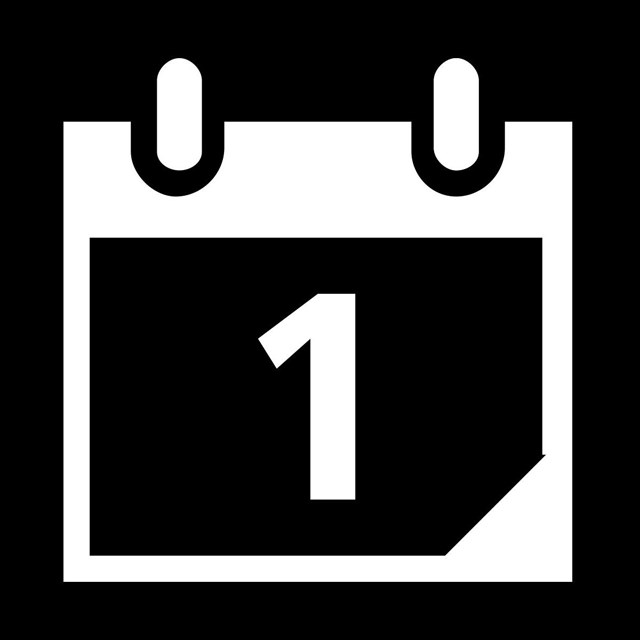 A black and white pictograph of a calendar.