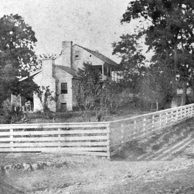 black & white picture of two story house in 1860.