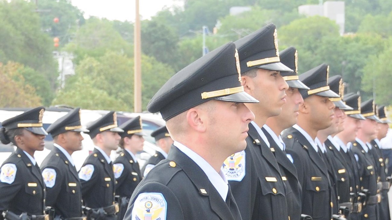 Two rows of US Park Police officers standing at attention