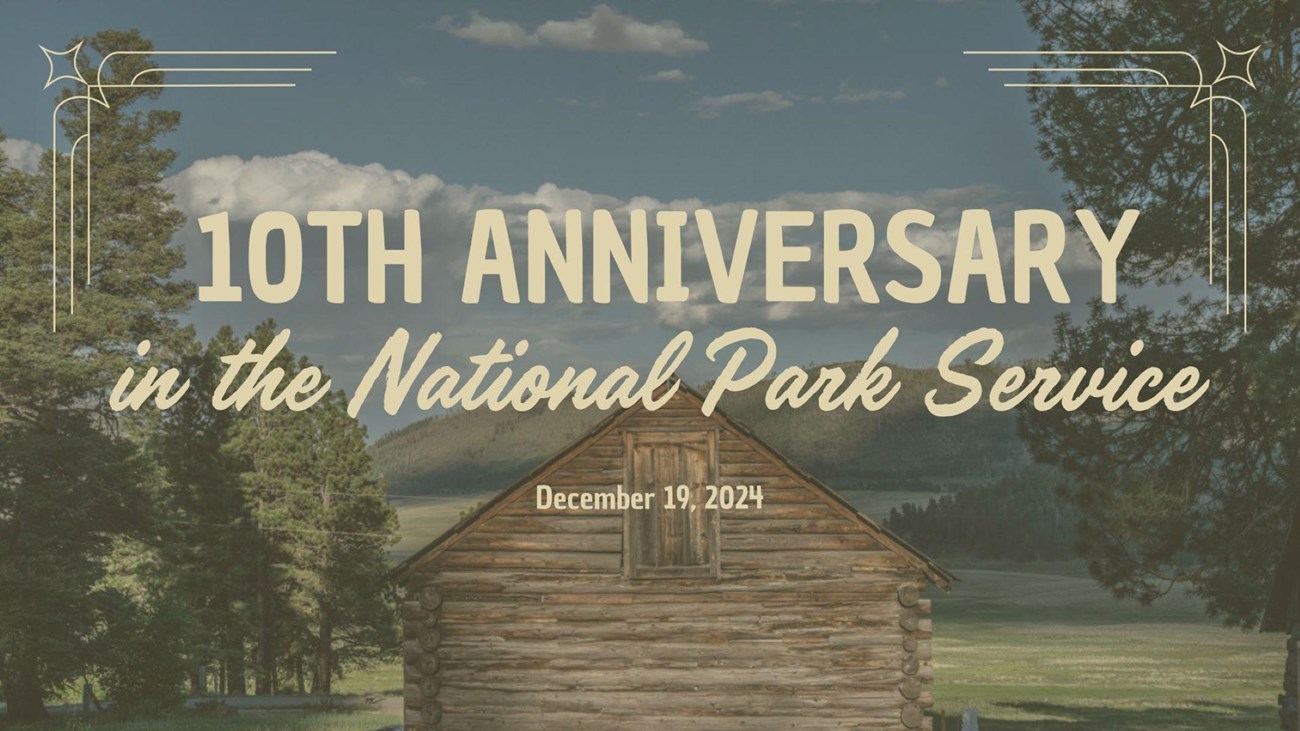 A graphic showing a log cabin overlooking a grassland. Text: "10th anniversary in the NPS."