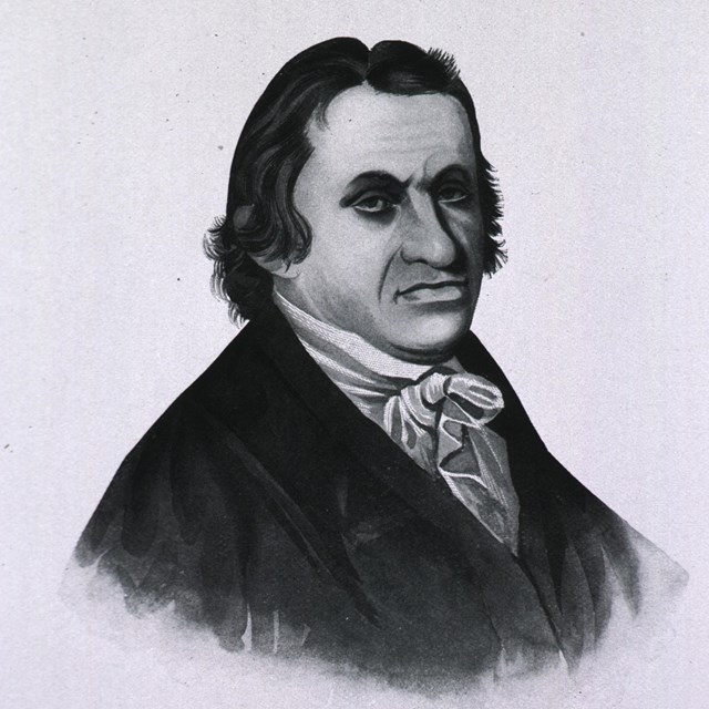 An engraved portrait of a man with dark hair and wearing a dark coat.