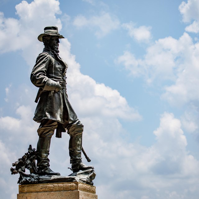 A large bronze statue of a man.