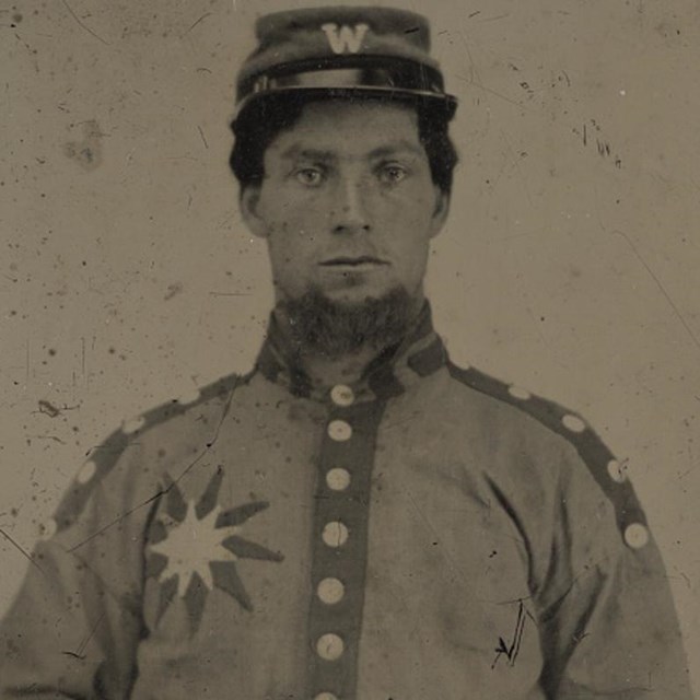 A Confederate soldier from Mississippi with sunflower over right breast