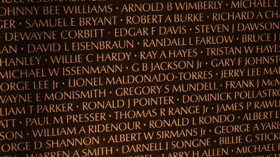 Names on the Vietnam Veterans Memorial wall.