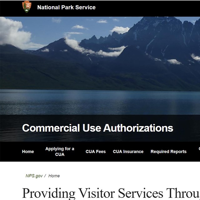 Screenshot of a float plane on the surface of a scenic lake, pointed towards mountains on the shore.